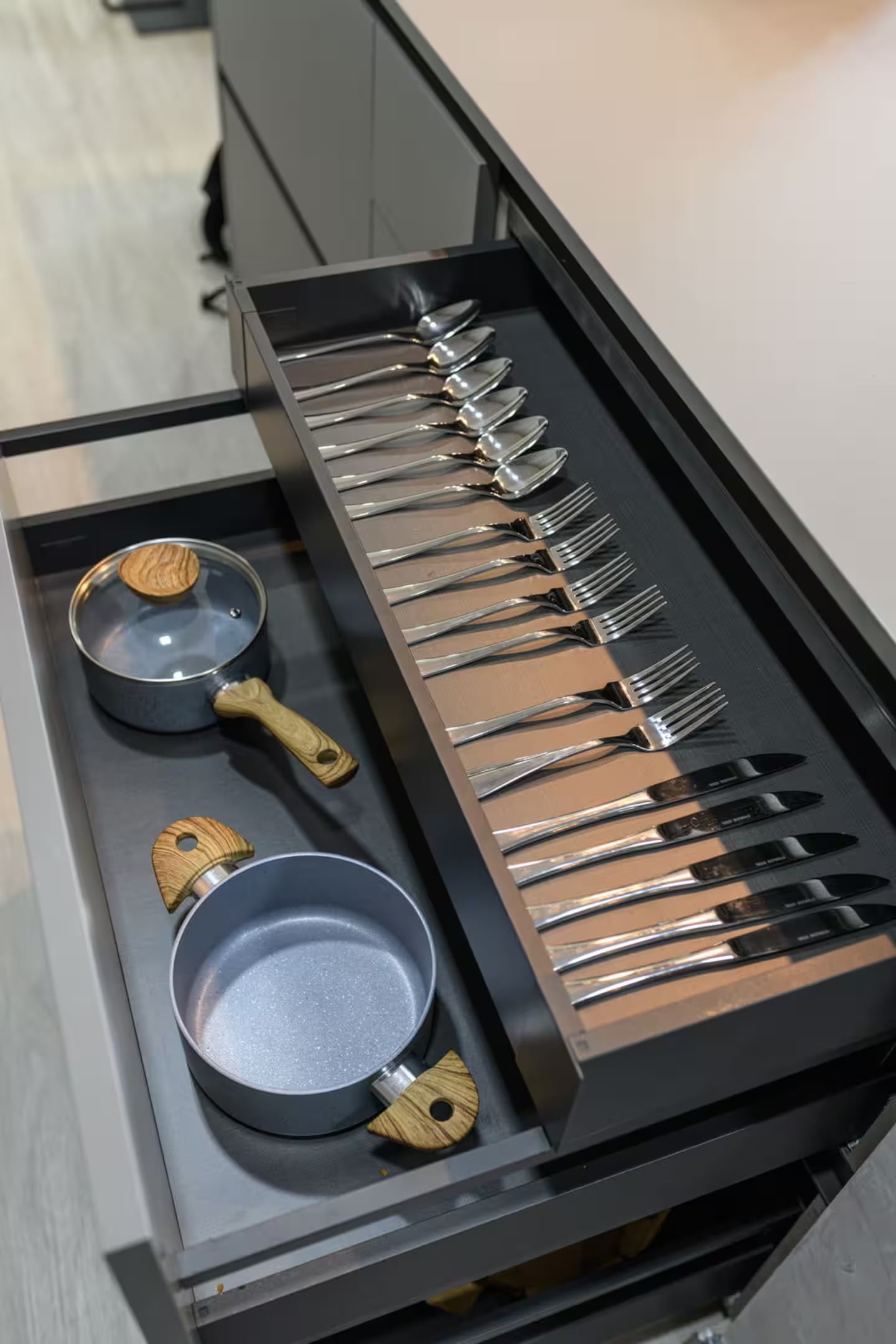 A fitted cutlery drawer and pans in a Selected Residences managed villa